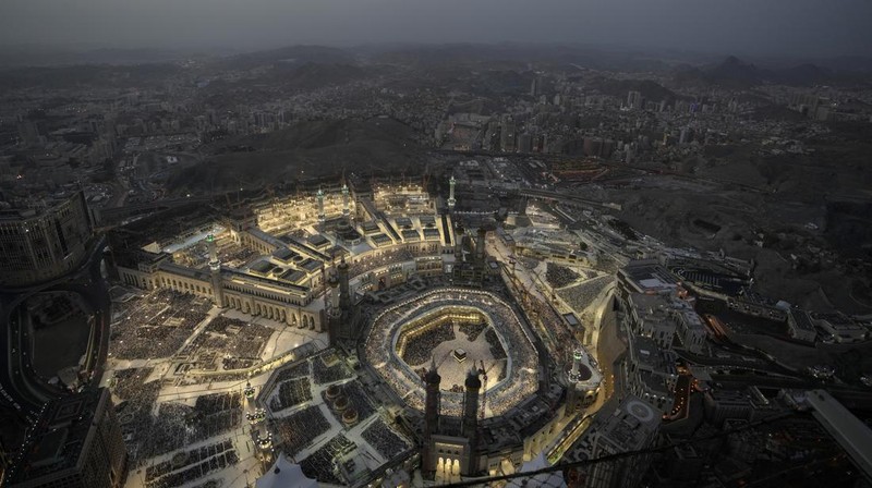 Muslim pilgrims circumambulate around the Kaaba, the cubic building at the Grand Mosque, during the annual hajj pilgrimage, in Mecca, Saudi Arabia, Thursday, June 22, 2023. Muslim pilgrims are converging on Saudi Arabia's holy city of Mecca for the largest hajj since the coronavirus pandemic severely curtailed access to one of Islam's five pillars. (AP Photo/Amr Nabil)