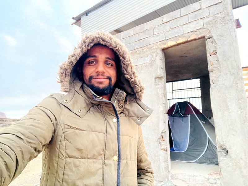 A Pakistani student, Usman Arshad, who walked 5400km from his home town, Okra, Pakistan to Mecca, Saudi Arabia to perform Haj, greets his family before heading out on his journey from Okra, Pakistan, in this handout photo obtained by Reuters on June 23, 2023. Usman Arshad/Handout via REUTERS ATTENTION EDITORS - THIS PICTURE WAS PROVIDED BY A THIRD PARTY