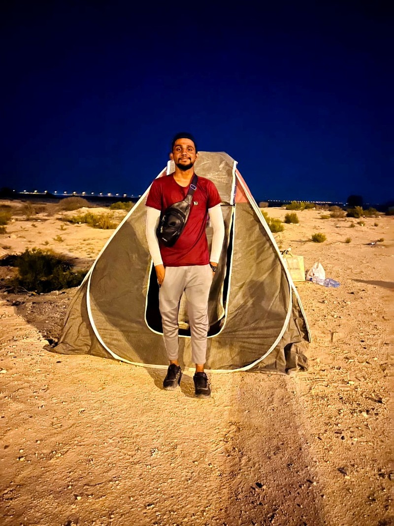 A Pakistani student, Usman Arshad, who walked 5400km from his home town, Okra, Pakistan to Mecca, Saudi Arabia to perform Haj, greets his family before heading out on his journey from Okra, Pakistan, in this handout photo obtained by Reuters on June 23, 2023. Usman Arshad/Handout via REUTERS ATTENTION EDITORS - THIS PICTURE WAS PROVIDED BY A THIRD PARTY