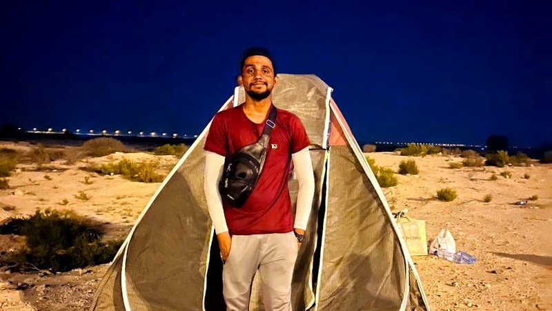 A Pakistani student, Usman Arshad, who walked 5400km from his home town, Okra, Pakistan to Mecca, Saudi Arabia to perform Haj, greets his family before heading out on his journey from Okra, Pakistan, in this handout photo obtained by Reuters on June 23, 2023. Usman Arshad/Handout via REUTERS ATTENTION EDITORS - THIS PICTURE WAS PROVIDED BY A THIRD PARTY