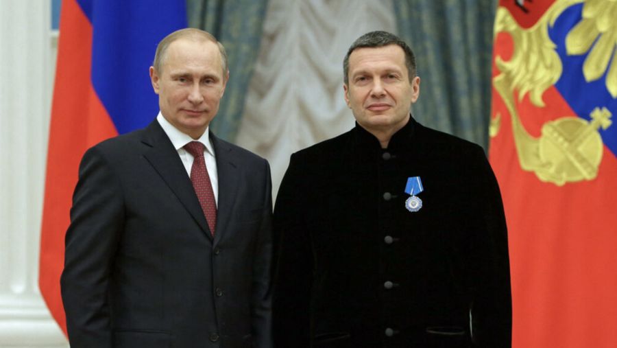 Russian President Vladimir Putin, left, and Russian television and radio host Vladimir Solovyov pose for a photo during a 2013 awards ceremony at the Kremlin. (© RIA Novosti/Mikhail Metzel/Presidential Press Service/AP Images)