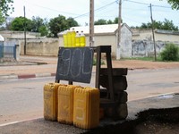 Smuggled Nigerian petrol on display with the price of a liter and a half in bottles at a roadside in Garoua, Cameroon June 21, 2023. REUTERS/Desire Danga Essigue