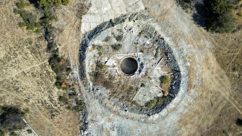 Smoke, believed to be methane gas, is seen at Virginia mine, a disused mine where a methane gas explosion killed at least 31 people last month, in Welkom, South Africa, June 26, 2023. REUTERS/Shafiek Tasiem