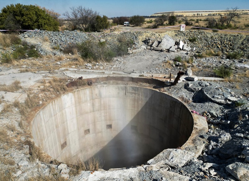 Smoke, believed to be methane gas, is seen at Virginia mine, a disused mine where a methane gas explosion killed at least 31 people last month, in Welkom, South Africa, June 26, 2023. REUTERS/Shafiek Tasiem