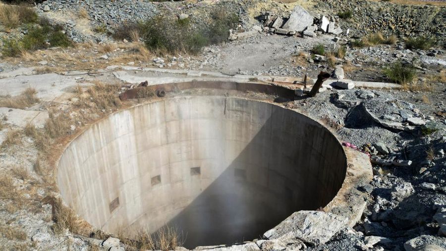 Smoke, believed to be methane gas, is seen at Virginia mine, a disused mine where a methane gas explosion killed at least 31 people last month, in Welkom, South Africa, June 26, 2023. REUTERS/Shafiek Tasiem