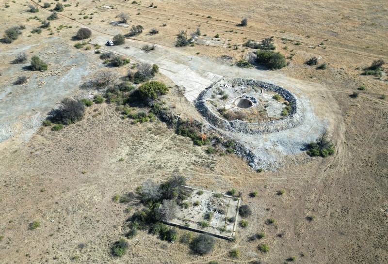 Smoke, believed to be methane gas, is seen at Virginia mine, a disused mine where a methane gas explosion killed at least 31 people last month, in Welkom, South Africa, June 26, 2023. REUTERS/Shafiek Tasiem