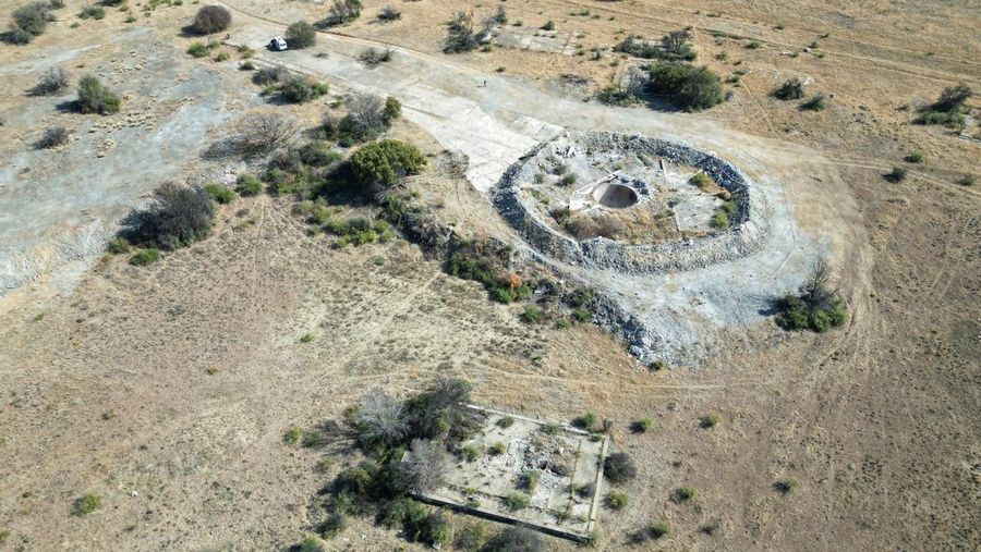 Smoke, believed to be methane gas, is seen at Virginia mine, a disused mine where a methane gas explosion killed at least 31 people last month, in Welkom, South Africa, June 26, 2023. REUTERS/Shafiek Tasiem