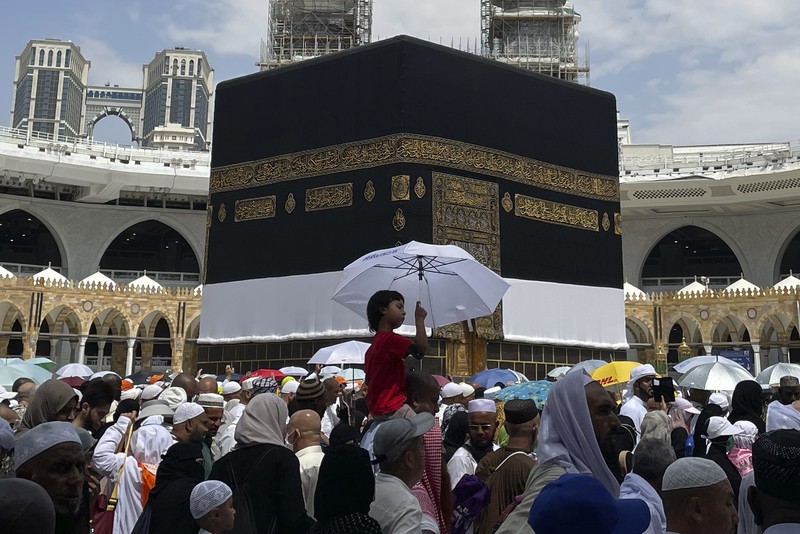 Muslim pilgrims circumambulate the Kaaba, the cubic building at the Grand Mosque, during the annual Hajj pilgrimage, in Mecca, Saudi Arabia, Saturday, July 1, 2023. (AP Photo/Amr Nabil)