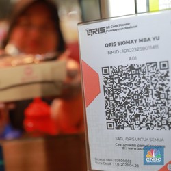 BI Larang Merchant Tarik 0,3% Tarif QRIS dari Konsumen