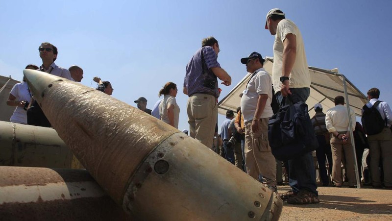 In this Oct. 5, 2016 photo, a Yemeni man displays an American-made CBU 58A/B, cluster bomb, in a police compound in Sanaa, Yemen. In the air campaign by Saudi Arabia and its allies against Yemen’s Shiite rebels, rights experts say there has been a pattern by the Saudi-led coalition in depending on faulty intelligence, failing to distinguish between civilian and military targets and disregarding the likelihood of civilian casualties. Experts say some of the strikes likely amount to war crimes. (AP Photo/Hani Mohammed)
