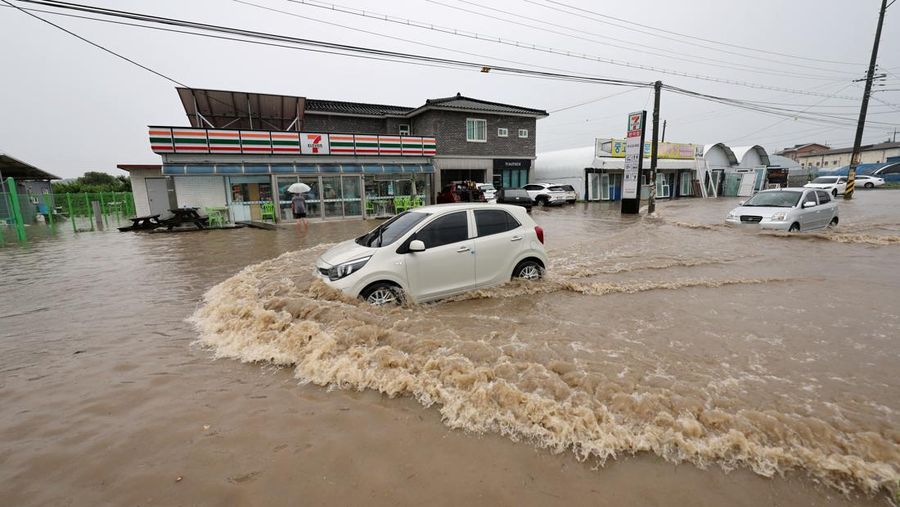 A view of a road submerged by a flooded river caused by heavy rain in Cheongju, South Korea, July 15, 2023.   Yonhap/via REUTERS       ATTENTION EDITORS - THIS IMAGE HAS BEEN SUPPLIED BY A THIRD PARTY. NO RESALES. NO ARCHIVE. SOUTH KOREA OUT. NO COMMERCIAL OR EDITORIAL SALES IN SOUTH KOREA. IMAGE BLURED AT SOURCE.