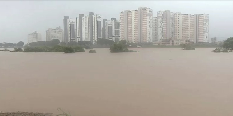 A view of a road submerged by a flooded river caused by heavy rain in Cheongju, South Korea, July 15, 2023.   Yonhap/via REUTERS       ATTENTION EDITORS - THIS IMAGE HAS BEEN SUPPLIED BY A THIRD PARTY. NO RESALES. NO ARCHIVE. SOUTH KOREA OUT. NO COMMERCIAL OR EDITORIAL SALES IN SOUTH KOREA. IMAGE BLURED AT SOURCE.