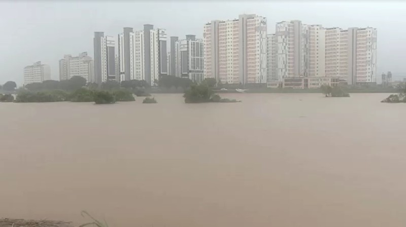 A view of a road submerged by a flooded river caused by heavy rain in Cheongju, South Korea, July 15, 2023.   Yonhap/via REUTERS       ATTENTION EDITORS - THIS IMAGE HAS BEEN SUPPLIED BY A THIRD PARTY. NO RESALES. NO ARCHIVE. SOUTH KOREA OUT. NO COMMERCIAL OR EDITORIAL SALES IN SOUTH KOREA. IMAGE BLURED AT SOURCE.