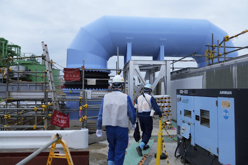 Japan Nuclear Fukushima This photo taken during a tour for The Associated Press shows a blue pipeline to transport seawater, part of the facility for the release of treated radioactive water to sea from the Fukushima Daiichi nuclear power plant, operated by Tokyo Electric Power Company Holdings, also known as TEPCO, in Futaba town, northeastern Japan, Friday, July 14, 2023. (AP Photo/Hiro Komae)