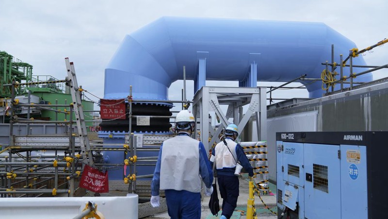 This photo taken during a tour for The Associated Press shows a blue pipeline to transport seawater, part of the facility for the release of treated radioactive water to sea from the Fukushima Daiichi nuclear power plant, operated by Tokyo Electric Power Company Holdings, also known as TEPCO, in Futaba town, northeastern Japan, Friday, July 14, 2023. (AP Photo/Hiro Komae)
