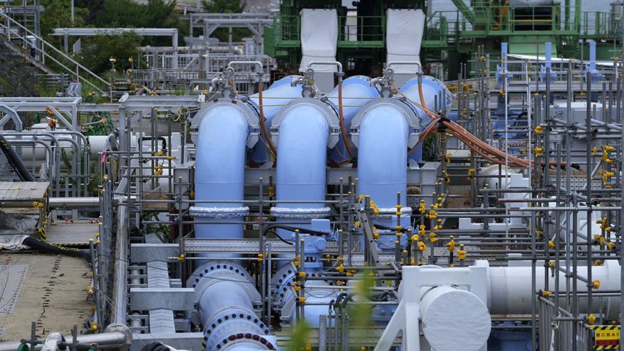 This photo taken during a tour for The Associated Press shows a blue pipeline to transport seawater, part of the facility for the release of treated radioactive water to sea from the Fukushima Daiichi nuclear power plant, operated by Tokyo Electric Power Company Holdings, also known as TEPCO, in Futaba town, northeastern Japan, Friday, July 14, 2023. (AP Photo/Hiro Komae)