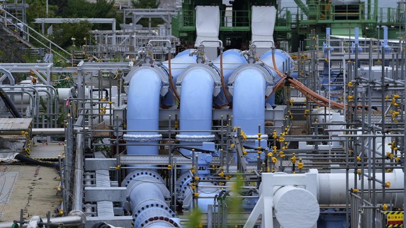 This photo taken during a tour for The Associated Press shows a blue pipeline to transport seawater, part of the facility for the release of treated radioactive water to sea from the Fukushima Daiichi nuclear power plant, operated by Tokyo Electric Power Company Holdings, also known as TEPCO, in Futaba town, northeastern Japan, Friday, July 14, 2023. (AP Photo/Hiro Komae)