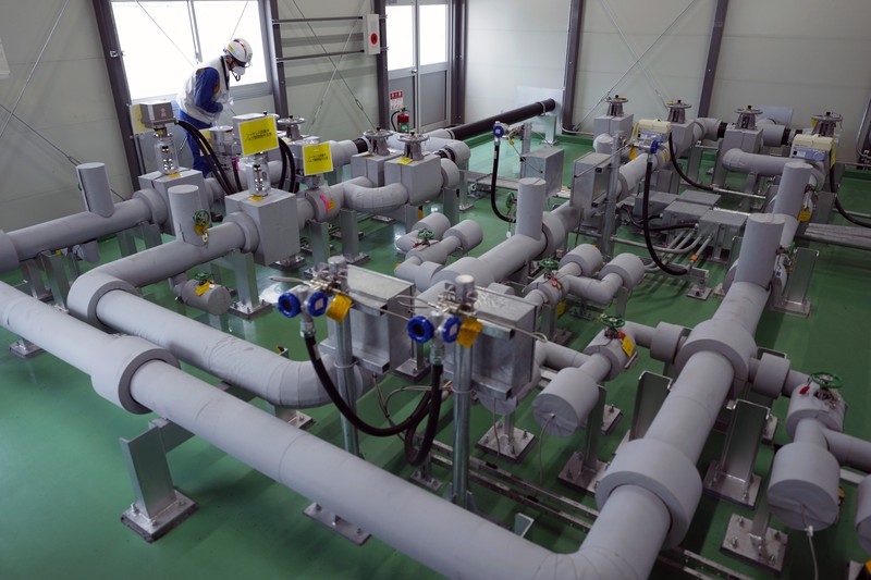 Japan Nuclear Fukushima This photo taken during a tour for The Associated Press shows a blue pipeline to transport seawater, part of the facility for the release of treated radioactive water to sea from the Fukushima Daiichi nuclear power plant, operated by Tokyo Electric Power Company Holdings, also known as TEPCO, in Futaba town, northeastern Japan, Friday, July 14, 2023. (AP Photo/Hiro Komae)