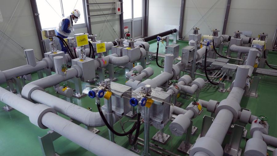 This photo taken during a tour for The Associated Press shows a blue pipeline to transport seawater, part of the facility for the release of treated radioactive water to sea from the Fukushima Daiichi nuclear power plant, operated by Tokyo Electric Power Company Holdings, also known as TEPCO, in Futaba town, northeastern Japan, Friday, July 14, 2023. (AP Photo/Hiro Komae)
