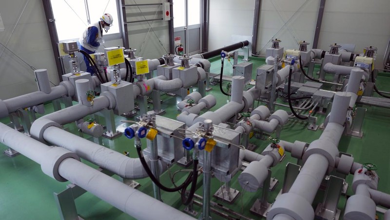 This photo taken during a tour for The Associated Press shows a blue pipeline to transport seawater, part of the facility for the release of treated radioactive water to sea from the Fukushima Daiichi nuclear power plant, operated by Tokyo Electric Power Company Holdings, also known as TEPCO, in Futaba town, northeastern Japan, Friday, July 14, 2023. (AP Photo/Hiro Komae)