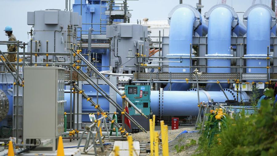 This photo taken during a tour for The Associated Press shows a blue pipeline to transport seawater, part of the facility for the release of treated radioactive water to sea from the Fukushima Daiichi nuclear power plant, operated by Tokyo Electric Power Company Holdings, also known as TEPCO, in Futaba town, northeastern Japan, Friday, July 14, 2023. (AP Photo/Hiro Komae)