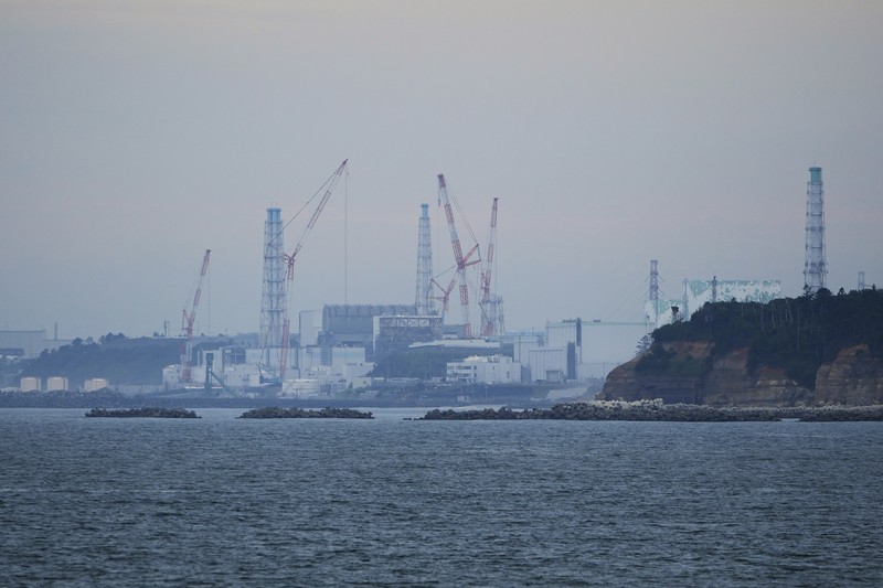 This photo taken during a tour for The Associated Press shows a blue pipeline to transport seawater, part of the facility for the release of treated radioactive water to sea from the Fukushima Daiichi nuclear power plant, operated by Tokyo Electric Power Company Holdings, also known as TEPCO, in Futaba town, northeastern Japan, Friday, July 14, 2023. (AP Photo/Hiro Komae)