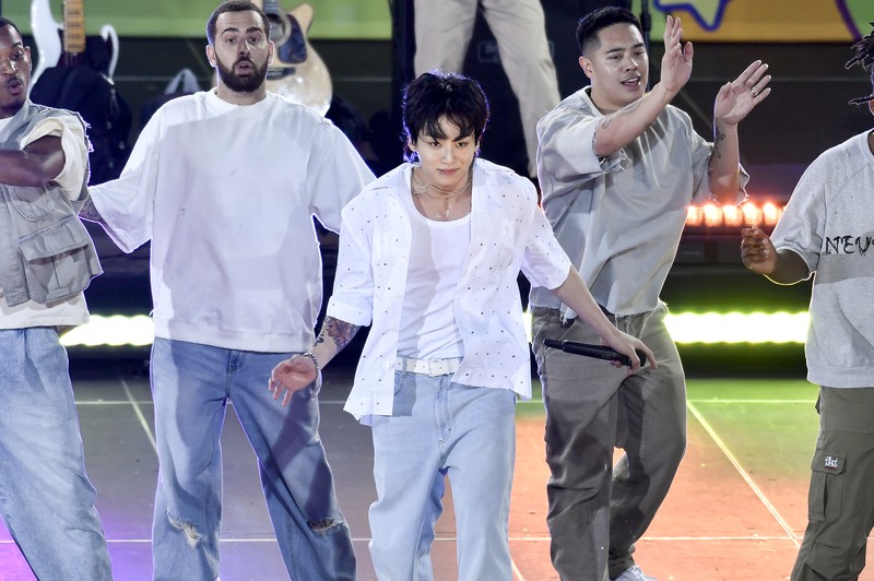 South Korean singer Jung Kook, center, from the K-pop band BTS performs solo on ABC's 