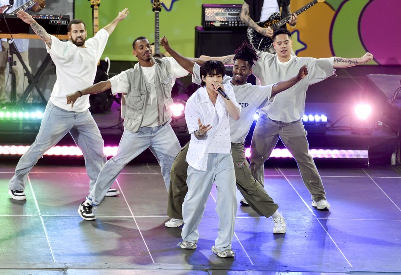 South Korean singer Jung Kook, center, from the K-pop band BTS performs solo on ABC's 