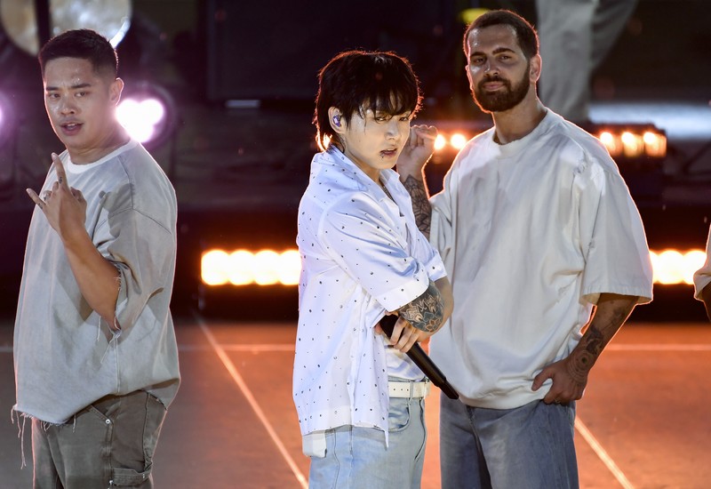 South Korean singer Jung Kook, center, from the K-pop band BTS performs solo on ABC's 