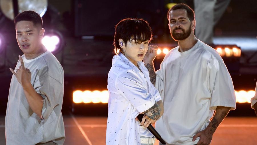 South Korean singer Jung Kook, center, from the K-pop band BTS performs solo on ABC's 