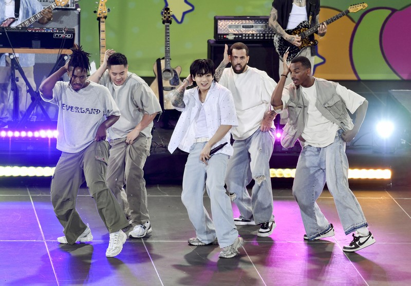 South Korean singer Jung Kook, center, from the K-pop band BTS performs solo on ABC's 