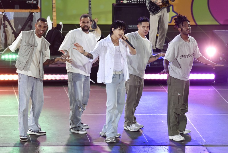 South Korean singer Jung Kook, center, from the K-pop band BTS performs solo on ABC's 