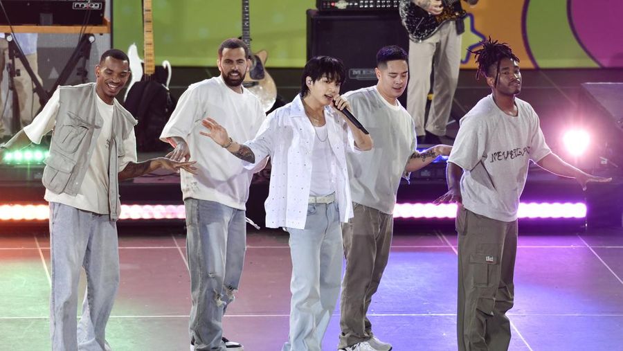South Korean singer Jung Kook, center, from the K-pop band BTS performs solo on ABC's