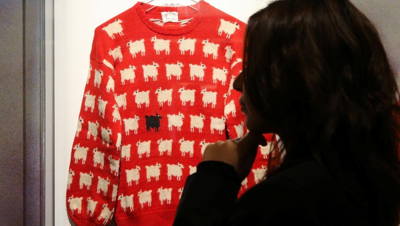 A 'black sheep' jumper worn by the Britain's late Diana, Princess of Wales, is displayed at Sotheby's, in London, Britain, July 17, 2023. The jumper, which is to go up for auction, was worn by Diana on several occasions, and was recently rediscovered in a box in the attic of the manufacturers along with correspondence from Diana's private secretary. REUTERS/Rachel Adams