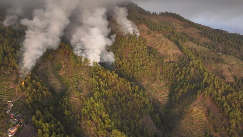 General view of a wildfire on the flank of a mountain in Bitsch near Brig, Switzerland, July 18, 2023. Picture taken with a long exposure. REUTERS/Denis Balibouse