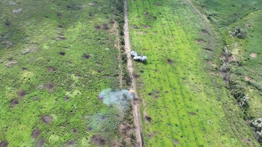 Drone footage shows a tank on fire after it was hit by ammunition from the air, amid Russia's attack on Ukraine, northwest of Bakhmut, Donetsk Region, Ukraine, in this still image from a video released by the Ukrainian army July 15, 2023. Aerial Reconnaissance of 420th Battalion of 57th Mechanized Brigade/Handout via REUTERS THIS IMAGE HAS BEEN SUPPLIED BY A THIRD PARTY. MANDATORY CREDIT