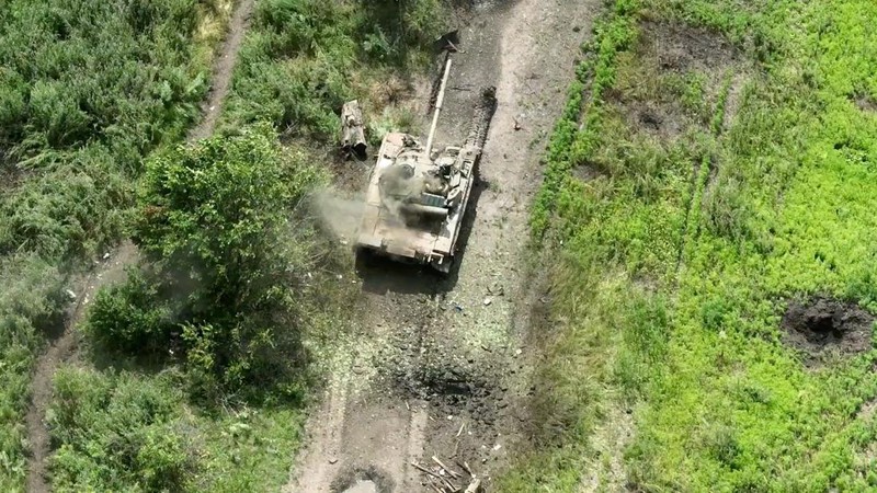 Drone footage shows a tank on fire after it was hit by ammunition from the air, amid Russia's attack on Ukraine, northwest of Bakhmut, Donetsk Region, Ukraine, in this still image from a video released by the Ukrainian army July 15, 2023. Aerial Reconnaissance of 420th Battalion of 57th Mechanized Brigade/Handout via REUTERS THIS IMAGE HAS BEEN SUPPLIED BY A THIRD PARTY. MANDATORY CREDIT