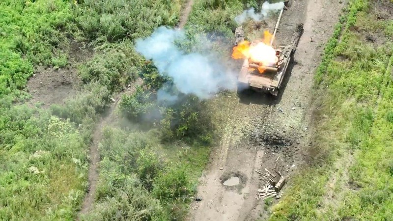 Drone footage shows a tank on fire after it was hit by ammunition from the air, amid Russia's attack on Ukraine, northwest of Bakhmut, Donetsk Region, Ukraine, in this still image from a video released by the Ukrainian army July 15, 2023. Aerial Reconnaissance of 420th Battalion of 57th Mechanized Brigade/Handout via REUTERS THIS IMAGE HAS BEEN SUPPLIED BY A THIRD PARTY. MANDATORY CREDIT