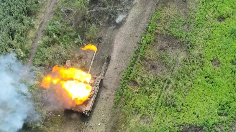 Drone footage shows a tank on fire after it was hit by ammunition from the air, amid Russia's attack on Ukraine, northwest of Bakhmut, Donetsk Region, Ukraine, in this still image from a video released by the Ukrainian army July 15, 2023. Aerial Reconnaissance of 420th Battalion of 57th Mechanized Brigade/Handout via REUTERS THIS IMAGE HAS BEEN SUPPLIED BY A THIRD PARTY. MANDATORY CREDIT