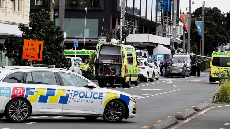Police cars are seen near a construction site following a shooting in the central business district, in Auckland, New Zealand July 20, 2023. REUTERS/David Rowland