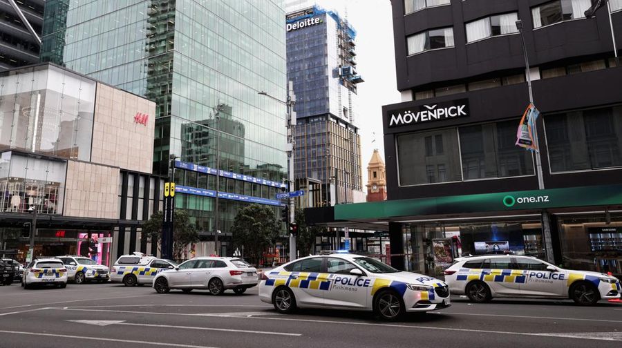 Police cars are seen near a construction site following a shooting in the central business district, in Auckland, New Zealand July 20, 2023. REUTERS/David Rowland