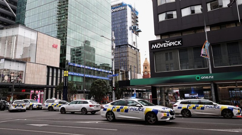 Police cars are seen near a construction site following a shooting in the central business district, in Auckland, New Zealand July 20, 2023. REUTERS/David Rowland