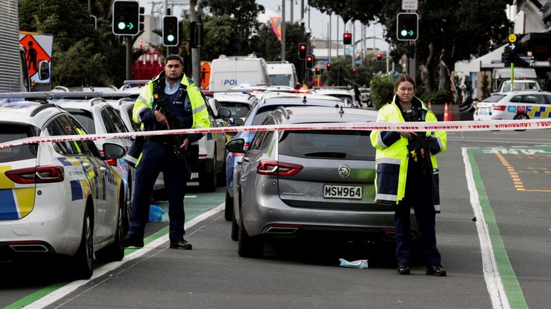 Police cars are seen near a construction site following a shooting in the central business district, in Auckland, New Zealand July 20, 2023. REUTERS/David Rowland