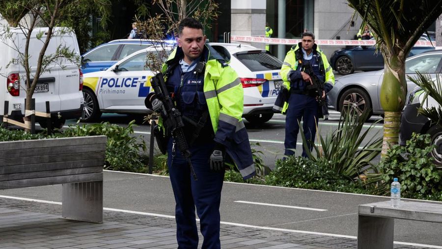 Police cars are seen near a construction site following a shooting in the central business district, in Auckland, New Zealand July 20, 2023. REUTERS/David Rowland