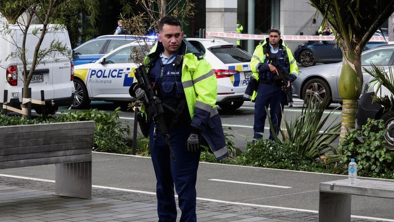 Police cars are seen near a construction site following a shooting in the central business district, in Auckland, New Zealand July 20, 2023. REUTERS/David Rowland