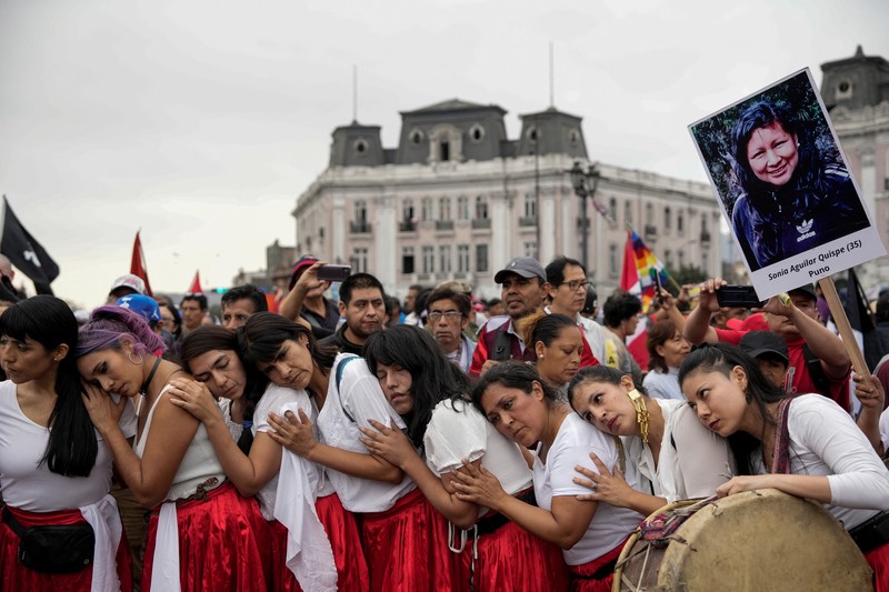 Anti-government protesters clash with police in downtown Lima, Peru, Wednesday, July 19, 2023. The protesters are demanding that Peruvian President Dina Boluarte call for immediate presidential elections as well as justice for those who were killed during protests after the ouster of her predecessor Pedro Castillo. (AP Photo/Rodrigo Abd)