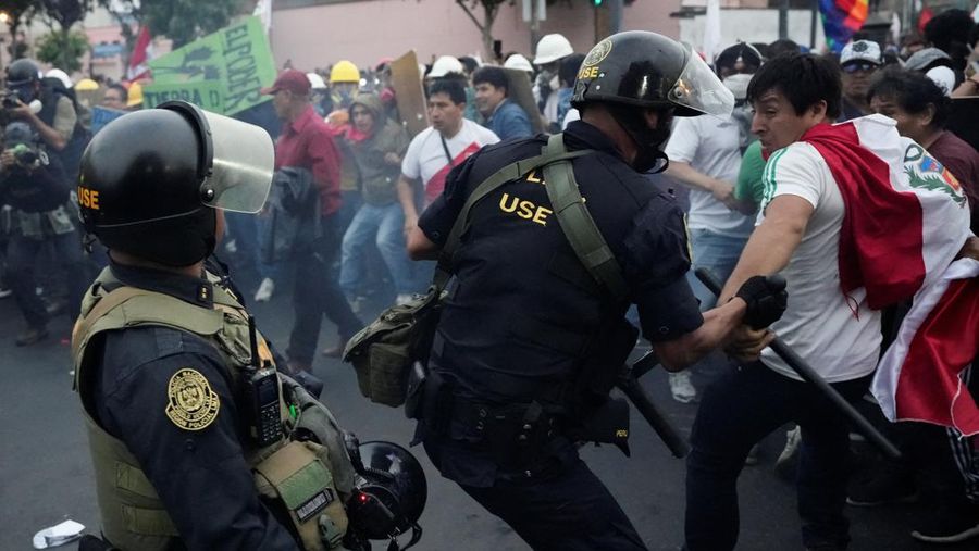 Anti-government protesters clash with police in downtown Lima, Peru, Wednesday, July 19, 2023. The protesters are demanding that Peruvian President Dina Boluarte call for immediate presidential elections as well as justice for those who were killed during protests after the ouster of her predecessor Pedro Castillo. (AP Photo/Rodrigo Abd)