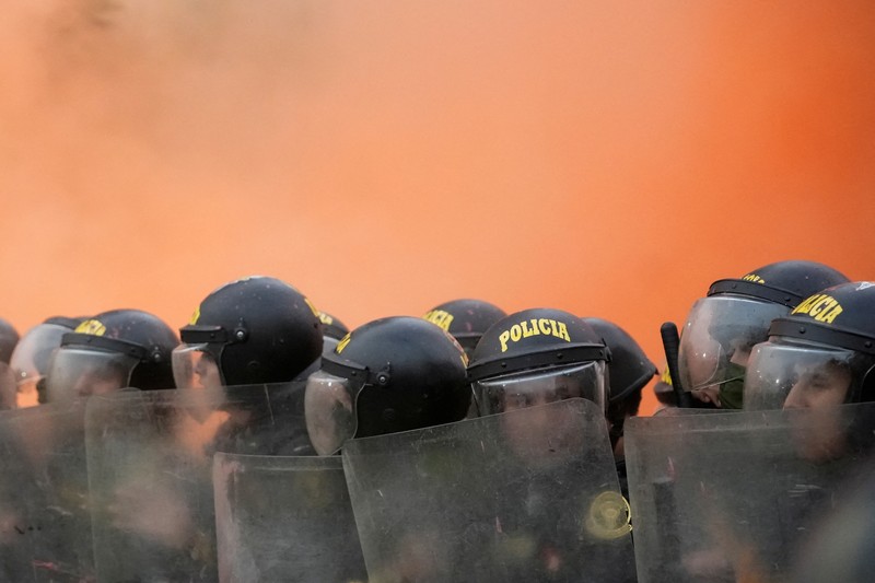 Anti-government protesters clash with police in downtown Lima, Peru, Wednesday, July 19, 2023. The protesters are demanding that Peruvian President Dina Boluarte call for immediate presidential elections as well as justice for those who were killed during protests after the ouster of her predecessor Pedro Castillo. (AP Photo/Rodrigo Abd)