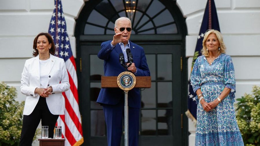 U.S. President Joe Biden, accompanied by first lady Jill Biden and U.S. Vice President Kamala Harris, speaks during the Congressional Picnic on the South Lawn of the White House in Washington, U.S., July 19, 2023. REUTERS/Evelyn Hockstein