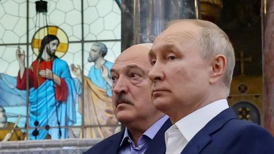 Russia's President Vladimir Putin (R) and Belarus' President Alexander Lukashenko (L) visit The Naval Cathedral of Saint Nicholas in Kronstadt, on Kotlin Island, outside Saint Petersburg, on July 23, 2023. Putin and his Belarus counterpart met a crowd of people in Kronstadt, in a rare walkabout for the longtime leaders a month after a deal to end a dramatic Wagner munity in Russia. (Photo by Alexandr Demyanchuk / SPUTNIK / AFP)